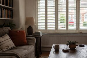 Living room shutters adding privacy and a finished look to a relaxed UK sitting room